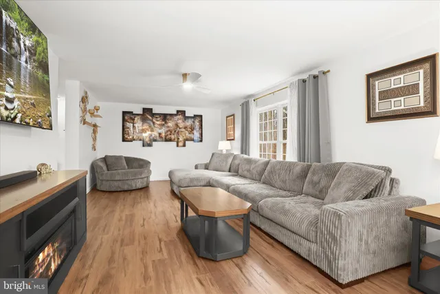 a bedroom with a bed couch and window