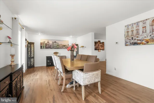 a bathroom with a granite countertop sink mirror and bathtub
