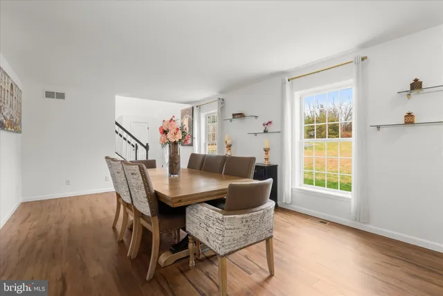 a bathroom with a shower sink and mirror