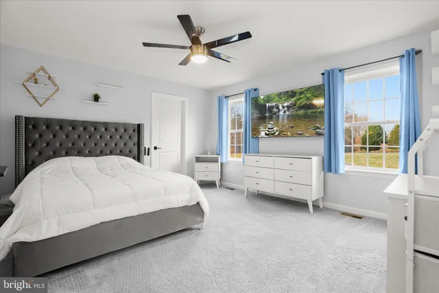 a bathroom with a shower sink and mirror