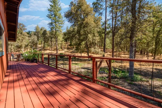 a view of pathway with a wrought fence