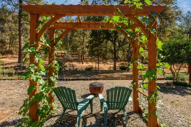 a view of balcony with two chairs and a table