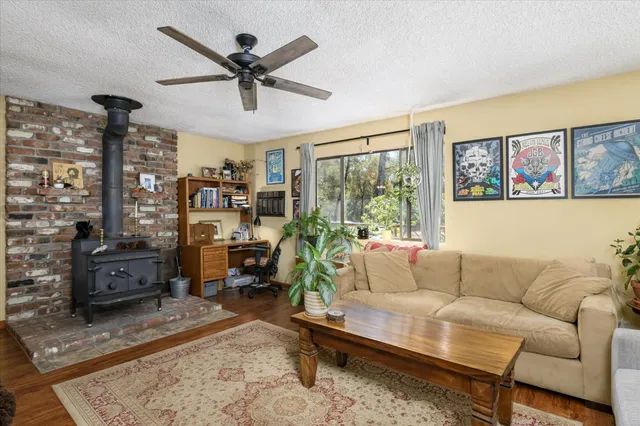 a living room with furniture or couch and a floor to ceiling window
