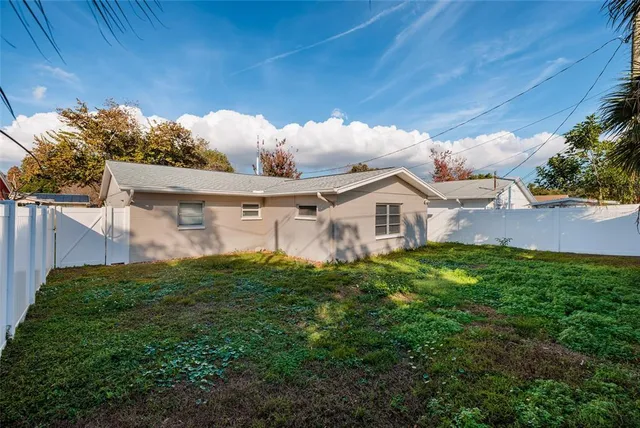 a view of a house with a yard