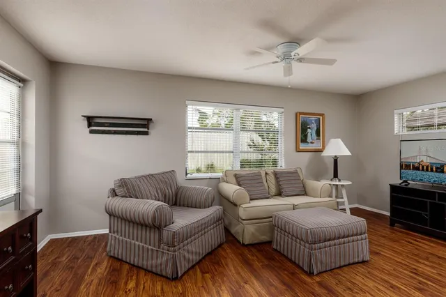 a living room with furniture and a window