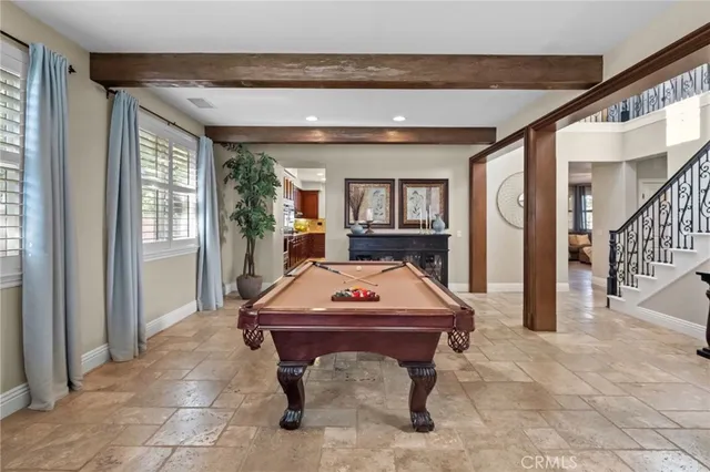 a living room with fireplace furniture and a window