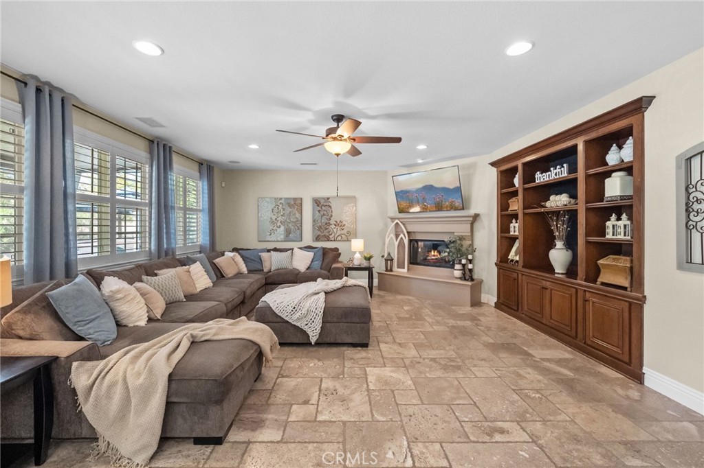 46331 Hunter Trail Temecula, CA 92592 - Photo 14 of 62 a living room with fireplace furniture and a window