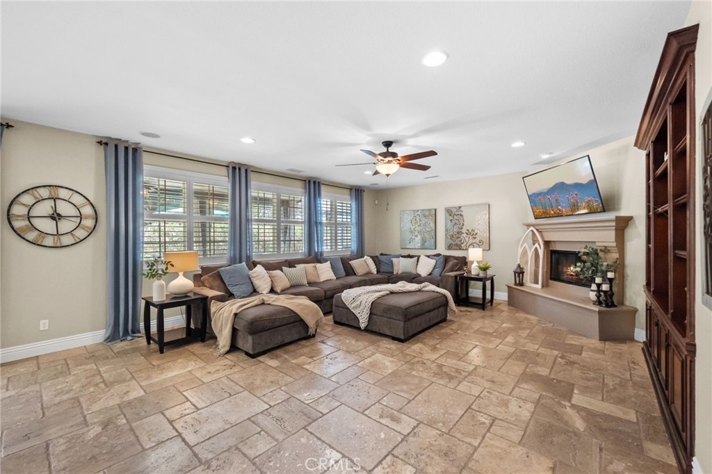 46331 Hunter Trail Temecula, CA 92592 - Photo 15 of 62 a living room with furniture a large window and a fireplace