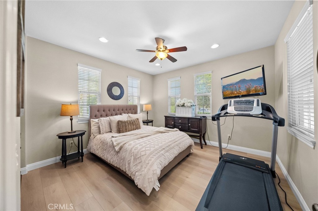 46331 Hunter Trail Temecula, CA 92592 - Photo 26 of 62 a bedroom with a bed and a chandelier