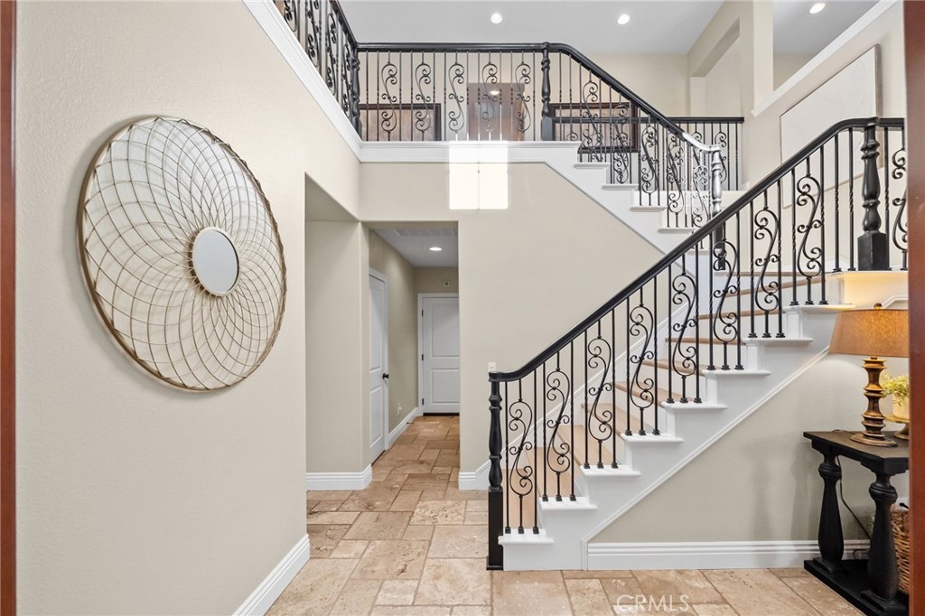 46331 Hunter Trail Temecula, CA 92592 - Photo 31 of 62 a view of staircase with railing and a chandelier