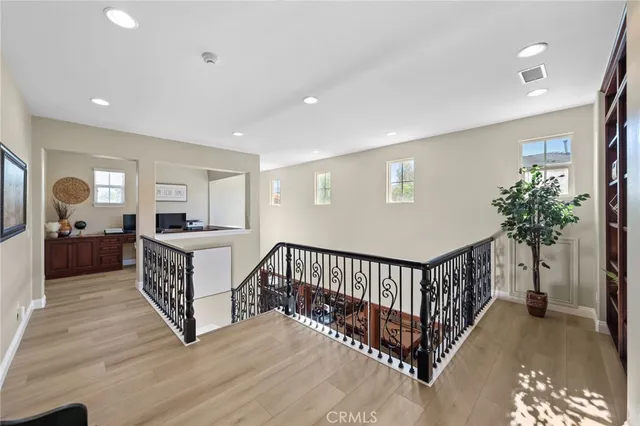 a spacious bathroom with a double vanity sink a mirror and a bathtub