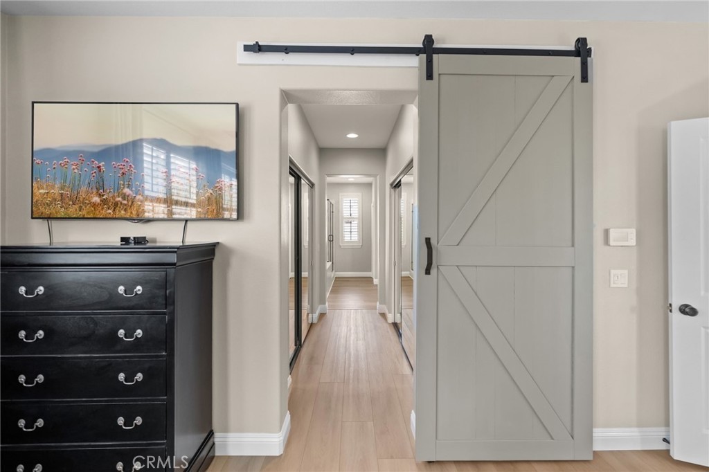 46331 Hunter Trail Temecula, CA 92592 - Photo 38 of 62 a view of a hallway with wooden floor