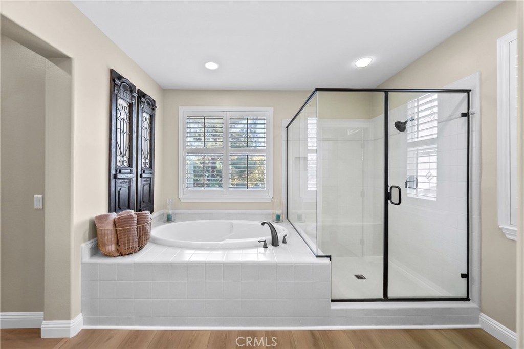 46331 Hunter Trail Temecula, CA 92592 - Photo 40 of 62 a bathroom with a bathtub and a shower