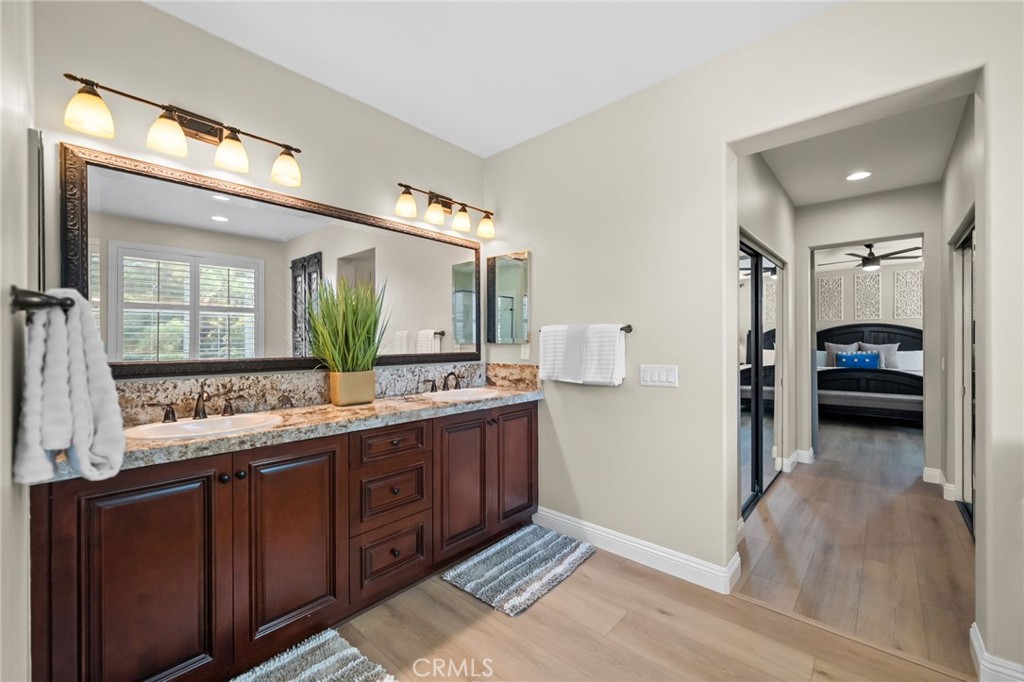46331 Hunter Trail Temecula, CA 92592 - Photo 41 of 62 a bathroom with a sink and a mirror