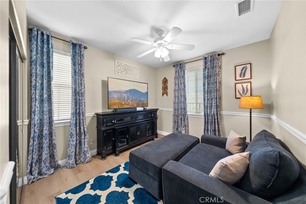 46331 Hunter Trail Temecula, CA 92592 - Photo 46 of 62 a living room with furniture and a flat screen tv
