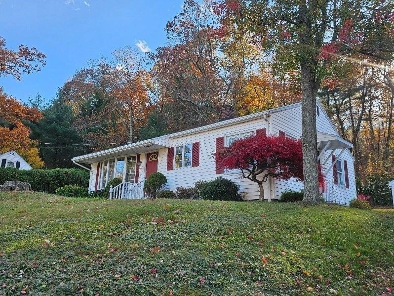 2022 Calkins Road Palmer, MA 01069 - Photo 3 of 38 a front view of house with yard and green space