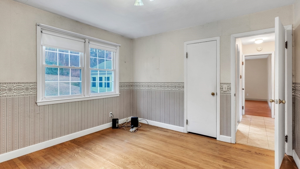 2022 Calkins Road Palmer, MA 01069 - Photo 31 of 38 an empty room with windows and closet