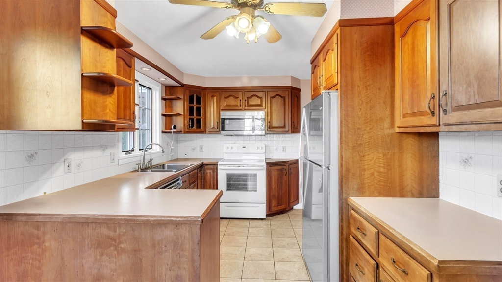 2022 Calkins Road Palmer, MA 01069 - Photo 9 of 38 a kitchen with granite countertop a sink a stove and cabinets