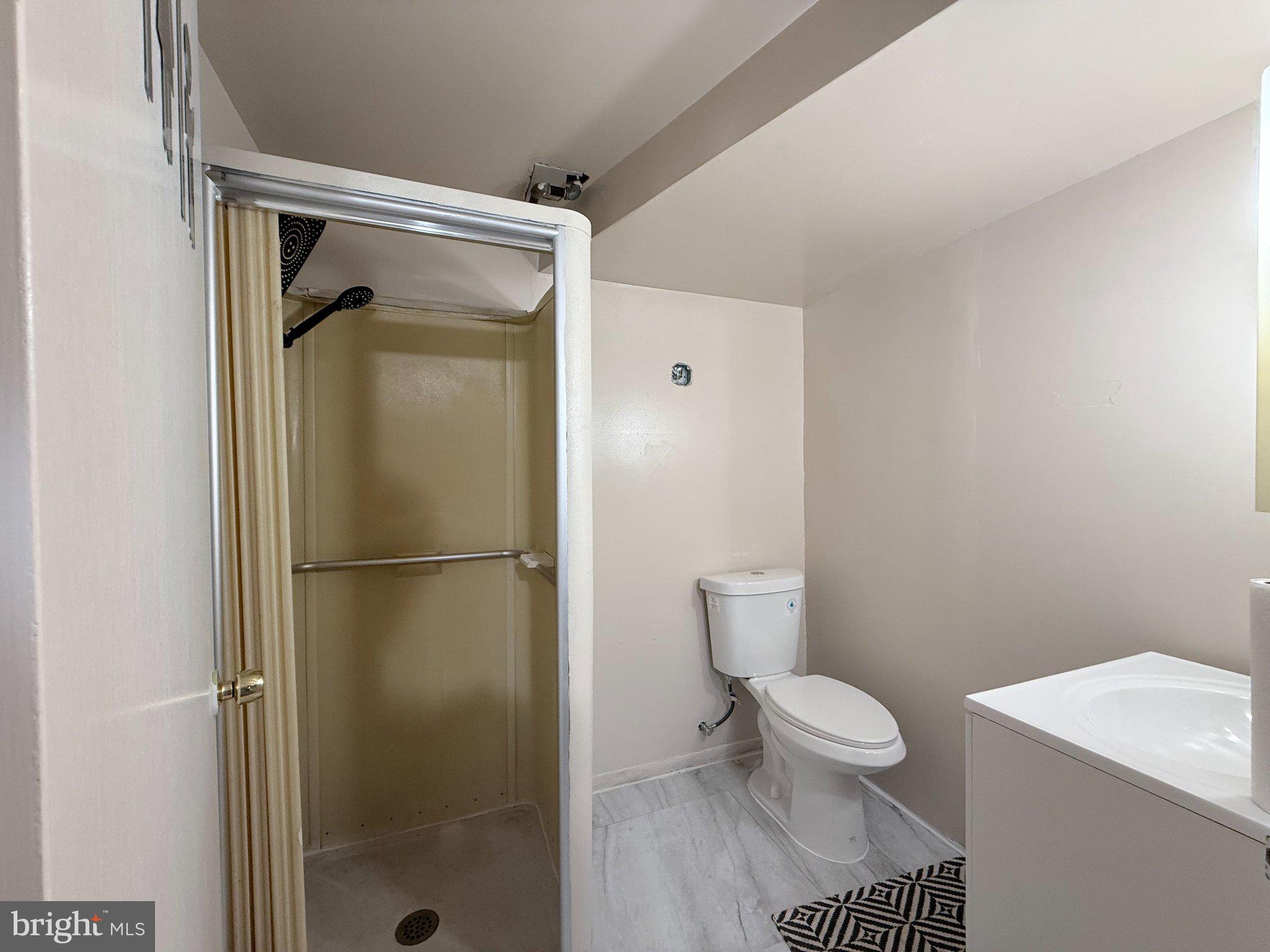 4203 Maple Road Morningside, MD 20746 - Photo 7 of 9 Modern bathroom with sleek finishes.