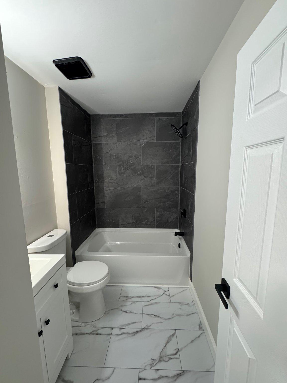 8 Framingham Road Beverly, NJ 08010 - Photo 16 of 35 a bathroom with a sink a toilet and shower
