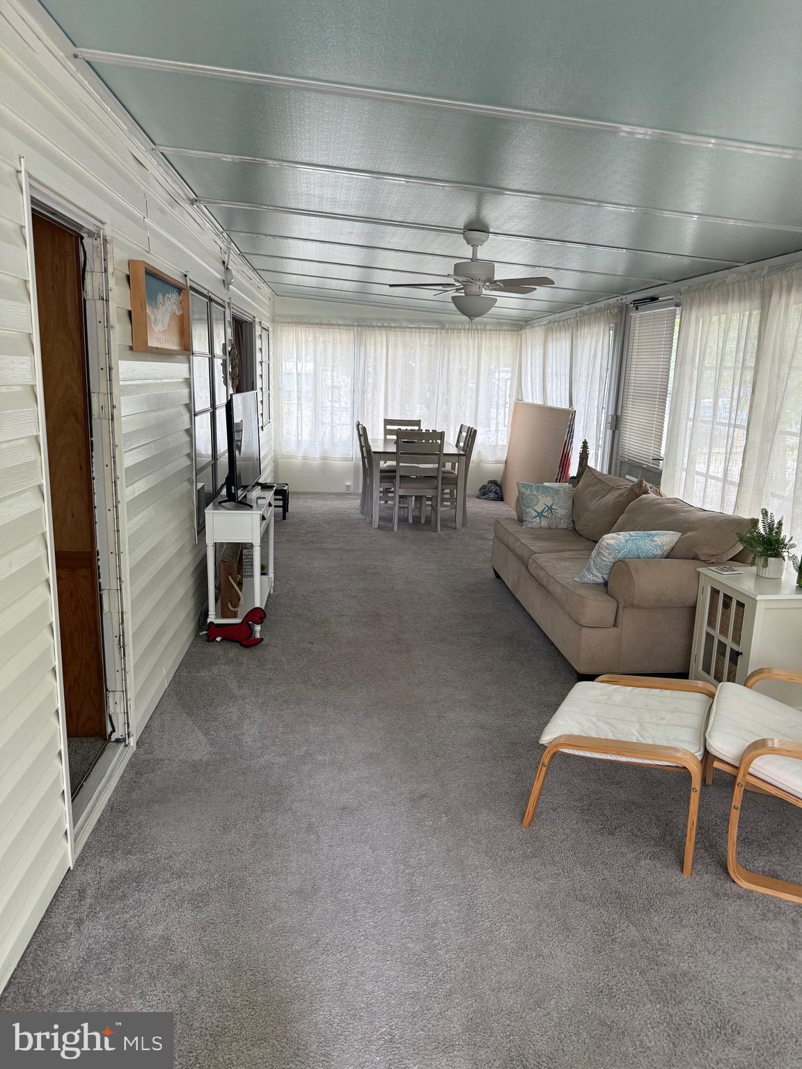 3066 Highway 9, Unit 246 Ocean View, NJ 08230 - Photo 2 of 8 a living room with furniture and a window