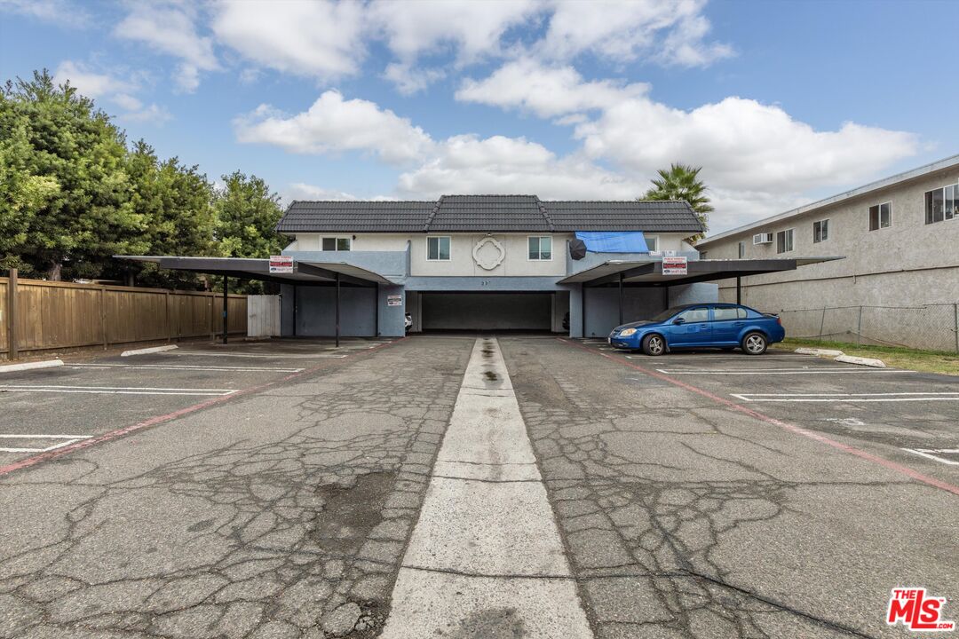 331 East Washington Avenue, Unit F Escondido, CA 92025 - Photo 1 of 19 a front view of a house with a yard