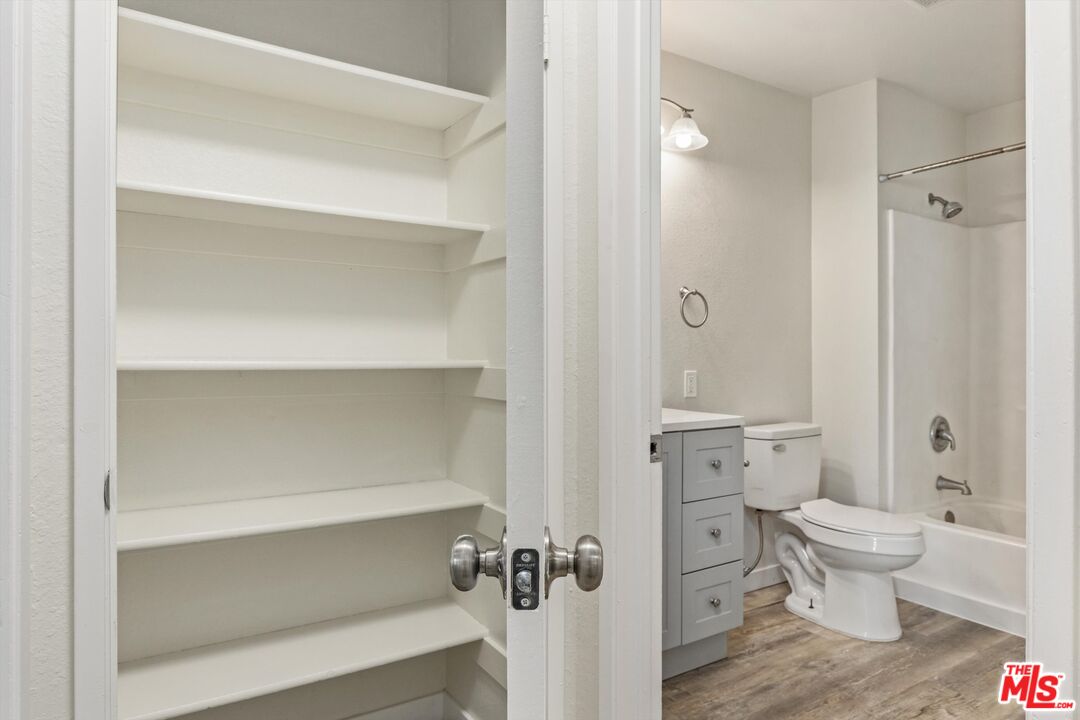 331 East Washington Avenue, Unit F Escondido, CA 92025 - Photo 13 of 19 a bathroom with a toilet and a shower