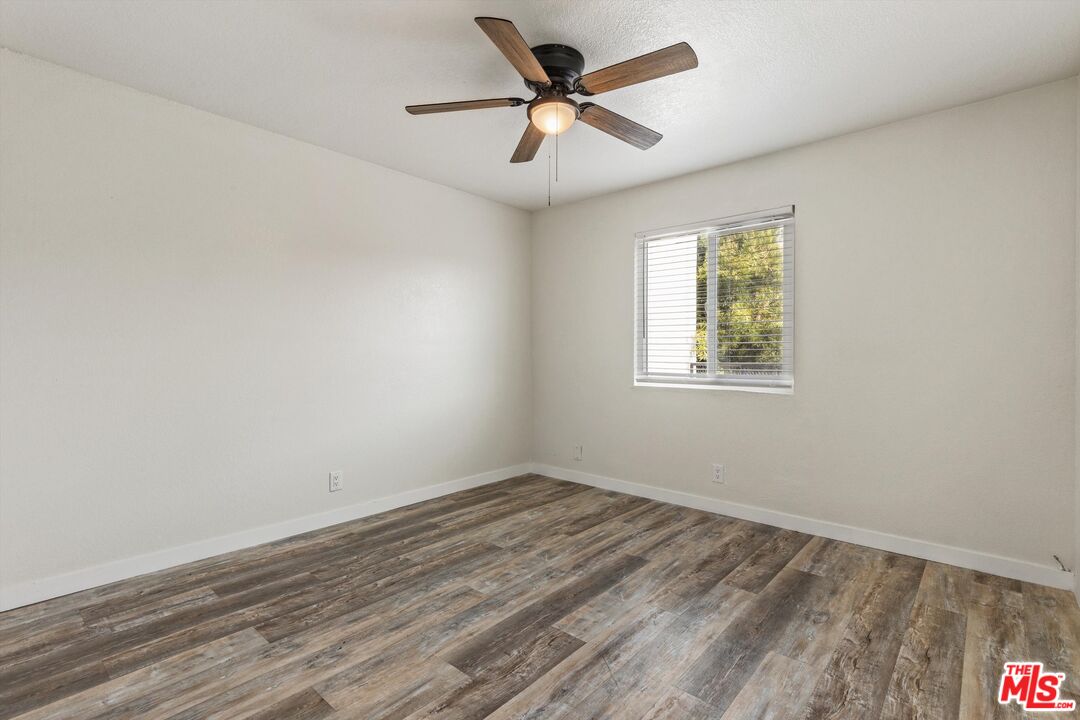 331 East Washington Avenue, Unit F Escondido, CA 92025 - Photo 15 of 19 wooden floor in an empty room with a window