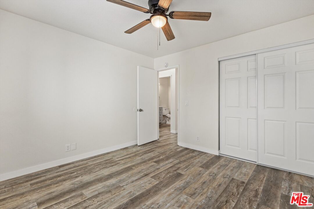 331 East Washington Avenue, Unit F Escondido, CA 92025 - Photo 16 of 19 a view of empty room with wooden floor and fan
