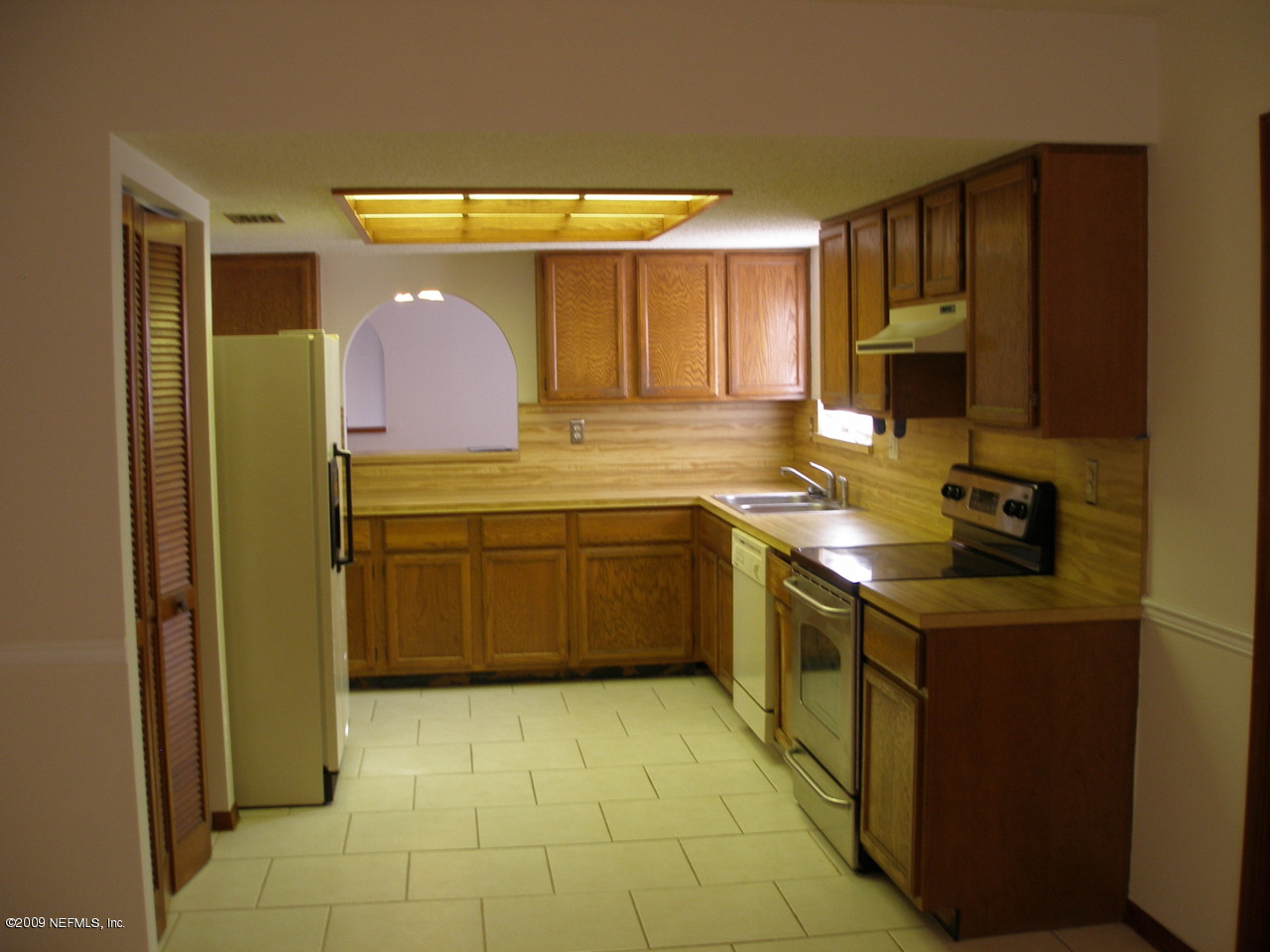 213 Gentian Road St. Augustine, FL 32086 - Photo 4 of 11 a kitchen with a sink cabinets and appliances