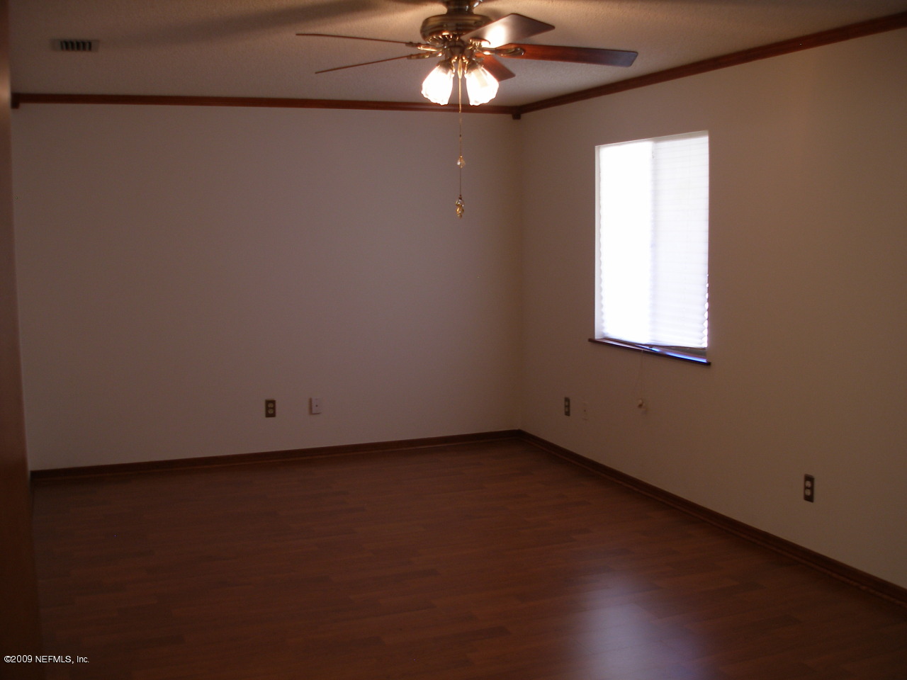 213 Gentian Road St. Augustine, FL 32086 - Photo 6 of 11 wooden floor in an empty room with a window
