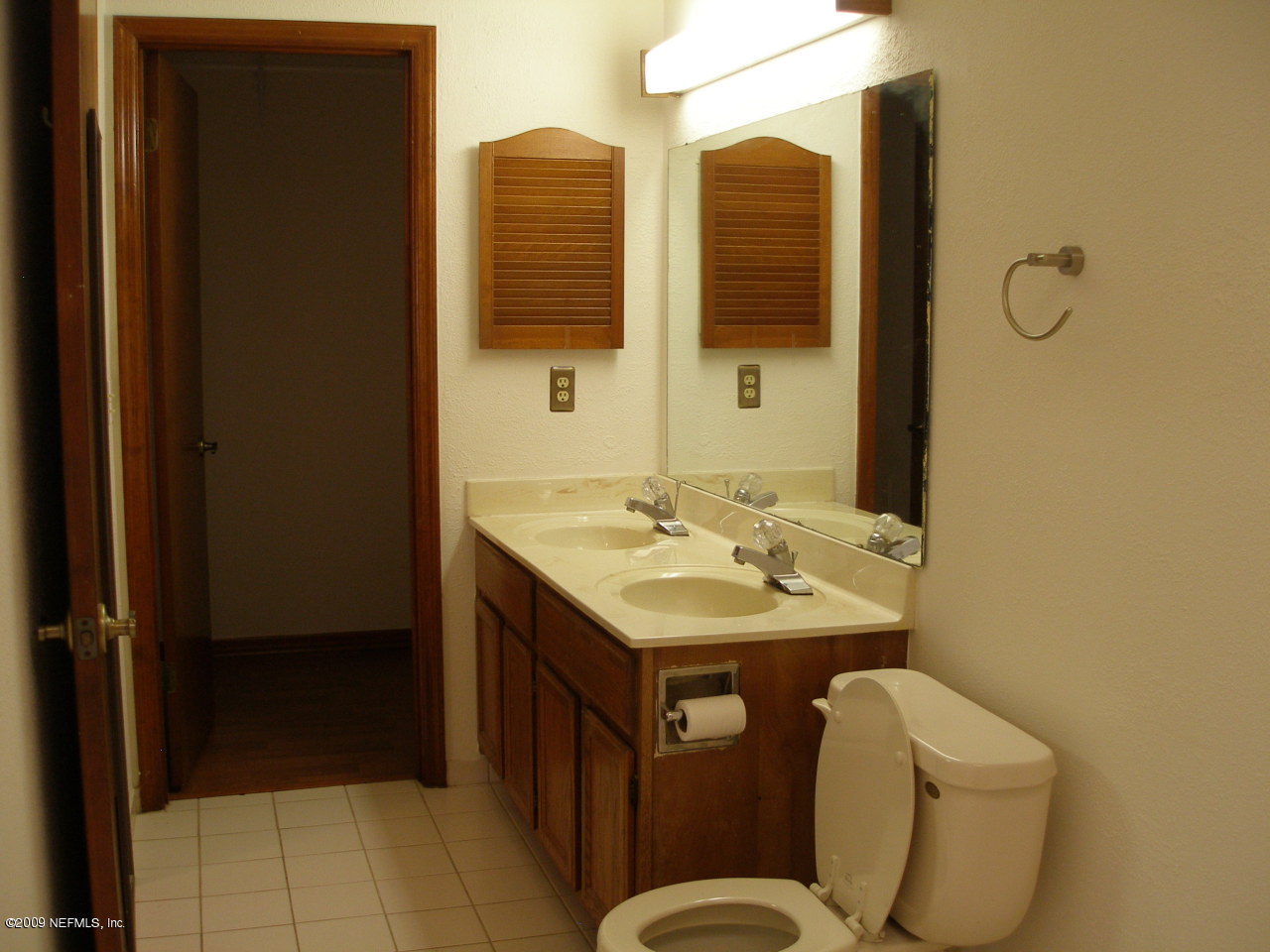 213 Gentian Road St. Augustine, FL 32086 - Photo 7 of 11 a bathroom with a toilet sink and mirror