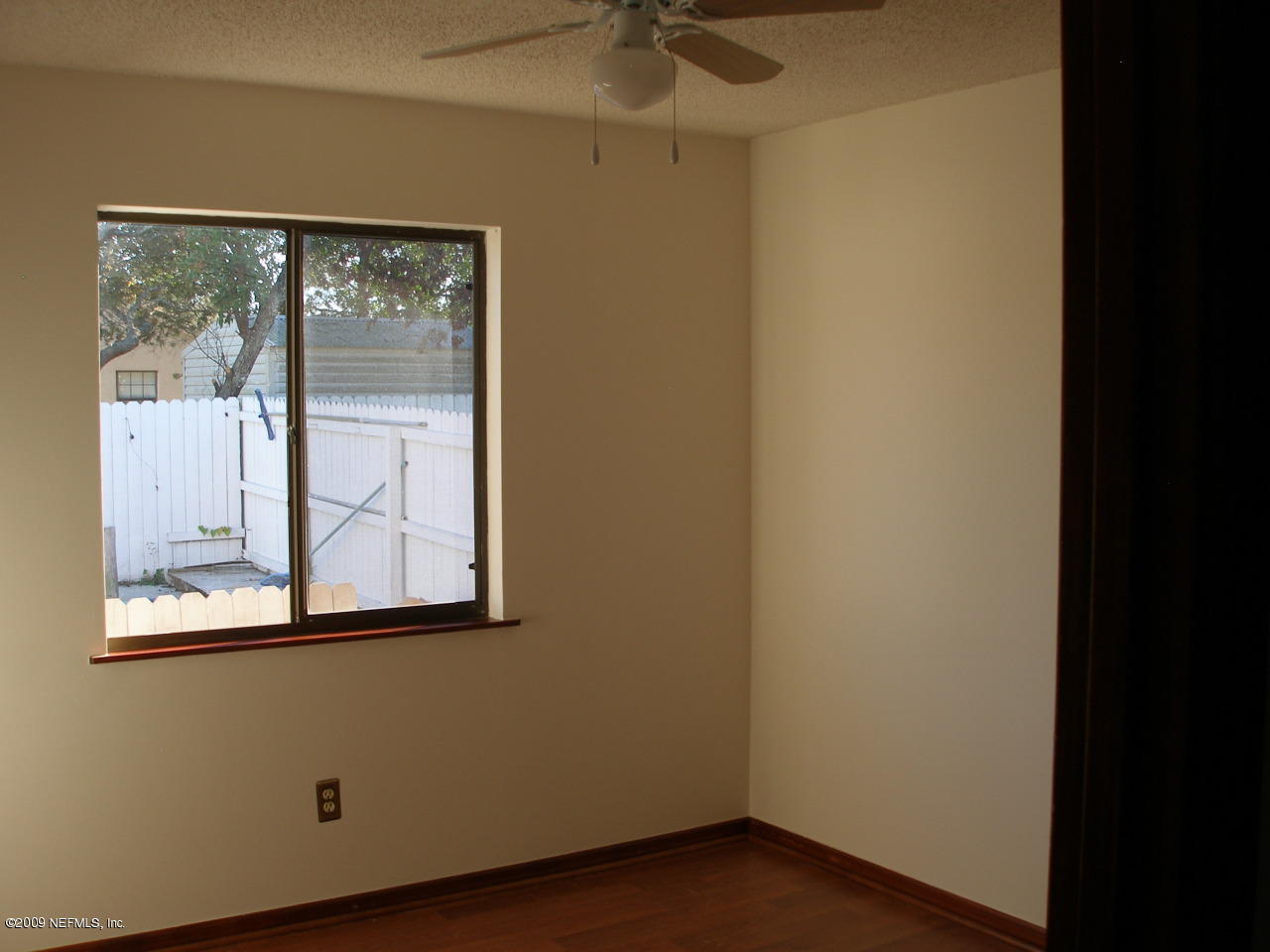213 Gentian Road St. Augustine, FL 32086 - Photo 8 of 11 a view of a small space with wooden floor and a window