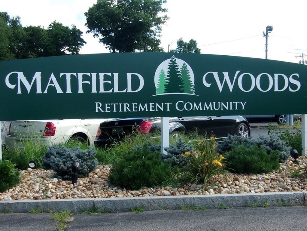41 Victorian Way West Bridgewater, MA 02379 - Photo 16 of 16 a view of outdoor space with signage and flags