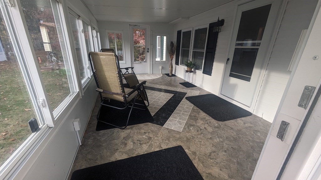41 Victorian Way West Bridgewater, MA 02379 - Photo 2 of 16 a living room with chairs and a refrigerator