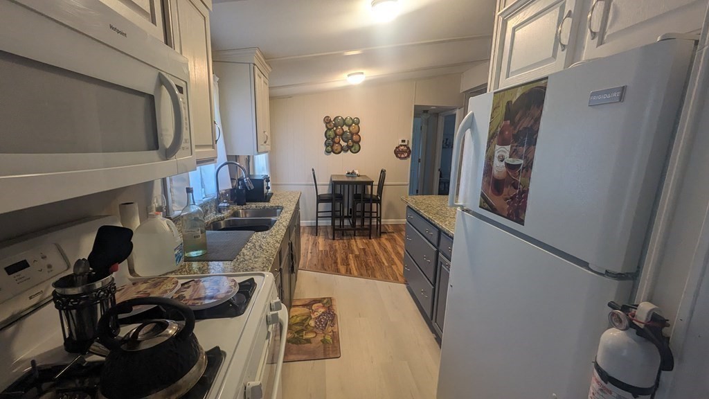 41 Victorian Way West Bridgewater, MA 02379 - Photo 5 of 16 a living room with furniture and a fireplace