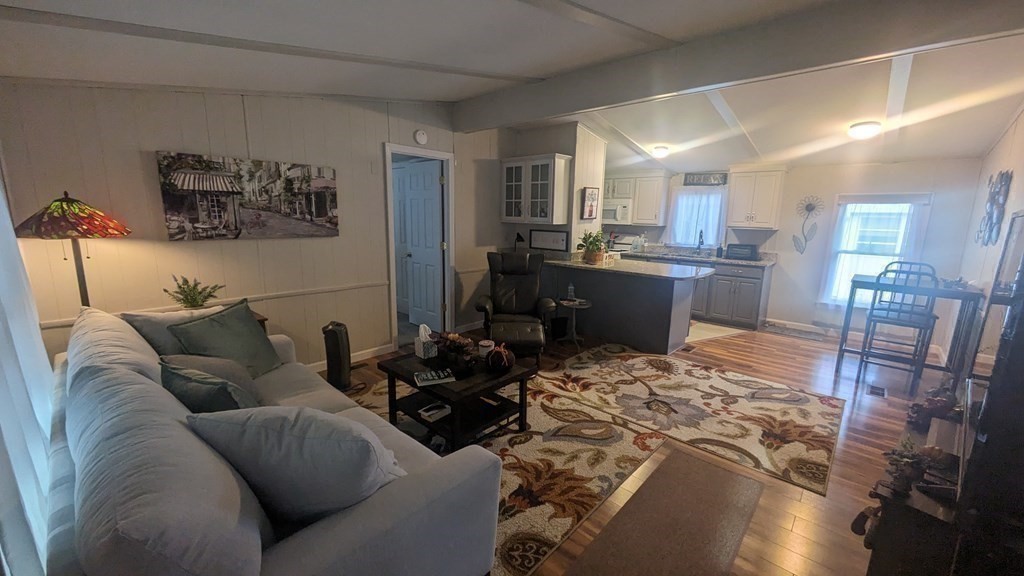 41 Victorian Way West Bridgewater, MA 02379 - Photo 6 of 16 a living room with furniture and a wooden floor