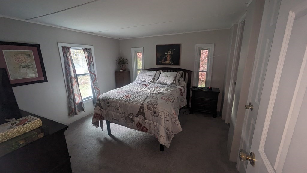 41 Victorian Way West Bridgewater, MA 02379 - Photo 9 of 16 a bed sitting in a bedroom next to a window