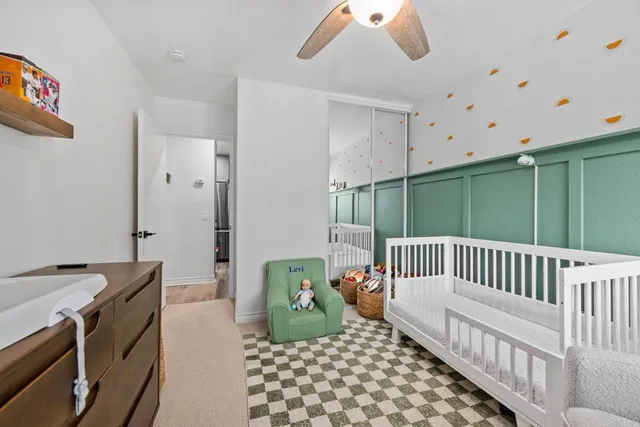 a bedroom with furniture and a window