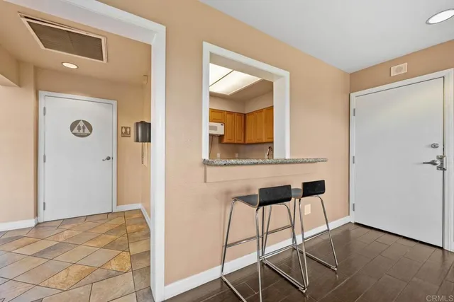 a view of a livingroom with furniture and front door