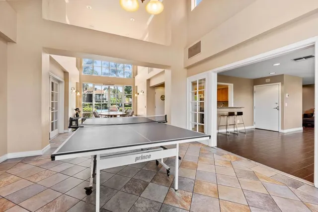 a room with gym equipment and view of living room