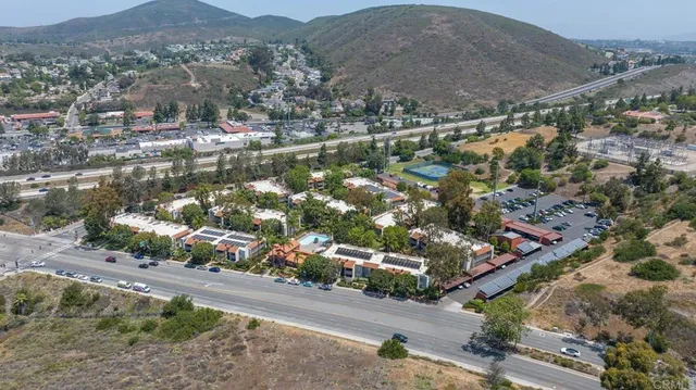 an aerial view of a houses with yard