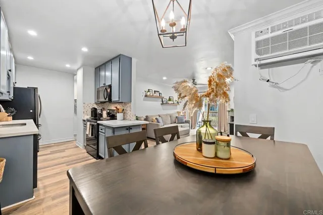a living room with fireplace furniture and a table