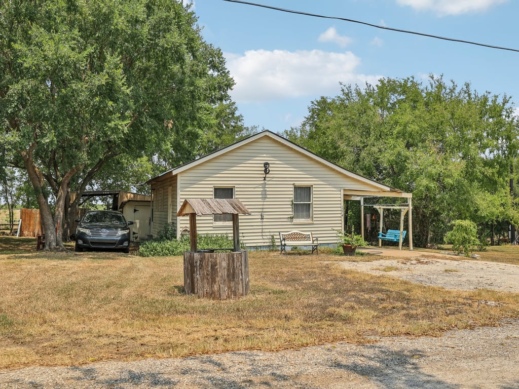Tbd Tbd Bluebonnet Road Lockhart, TX 78644 - Photo 14 of 20 a view of a house with a yard
