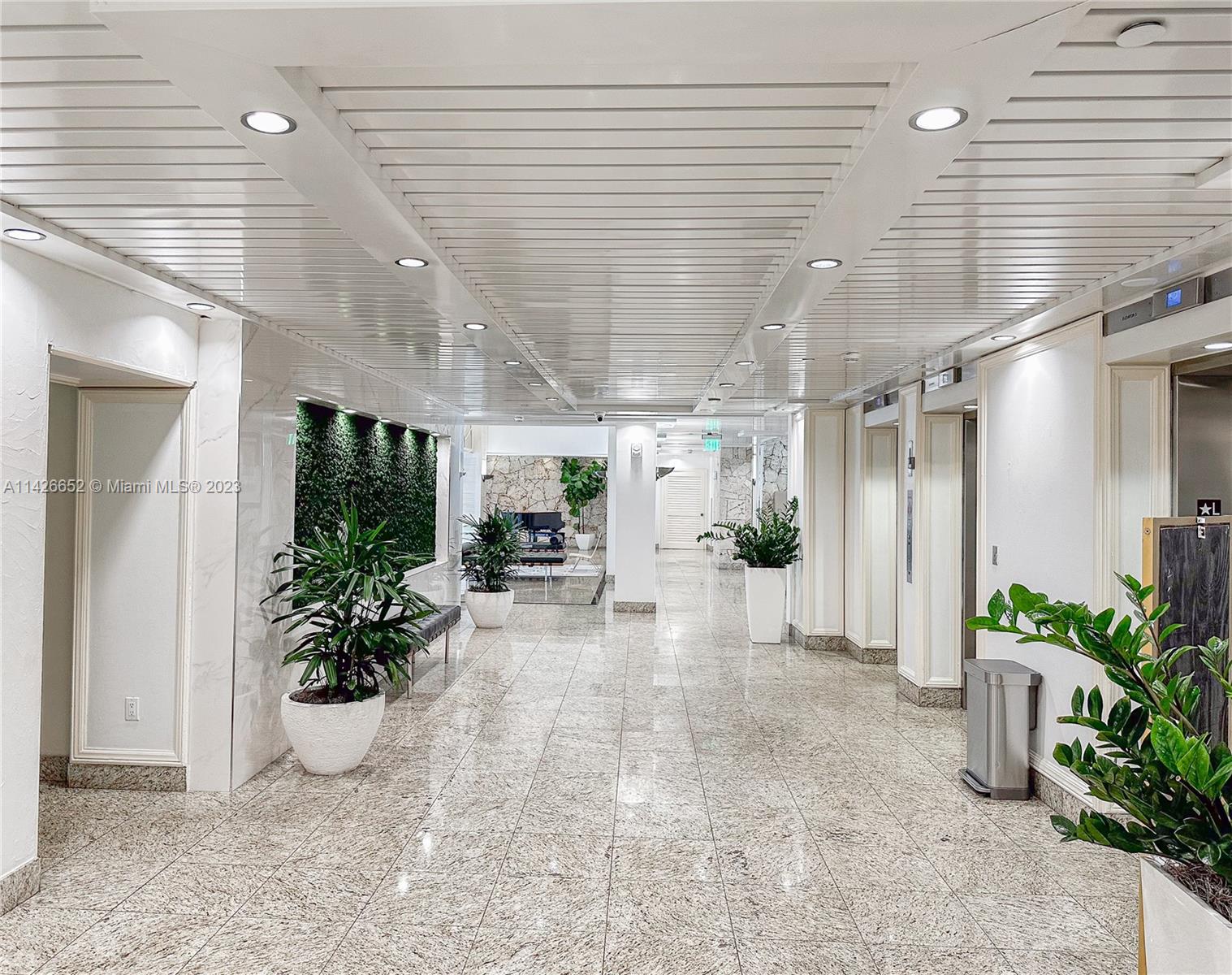 780 Northeast 69th Street, Unit 1408 Miami, FL 33138 - Photo 22 of 25 a view of a porch with a potted plant