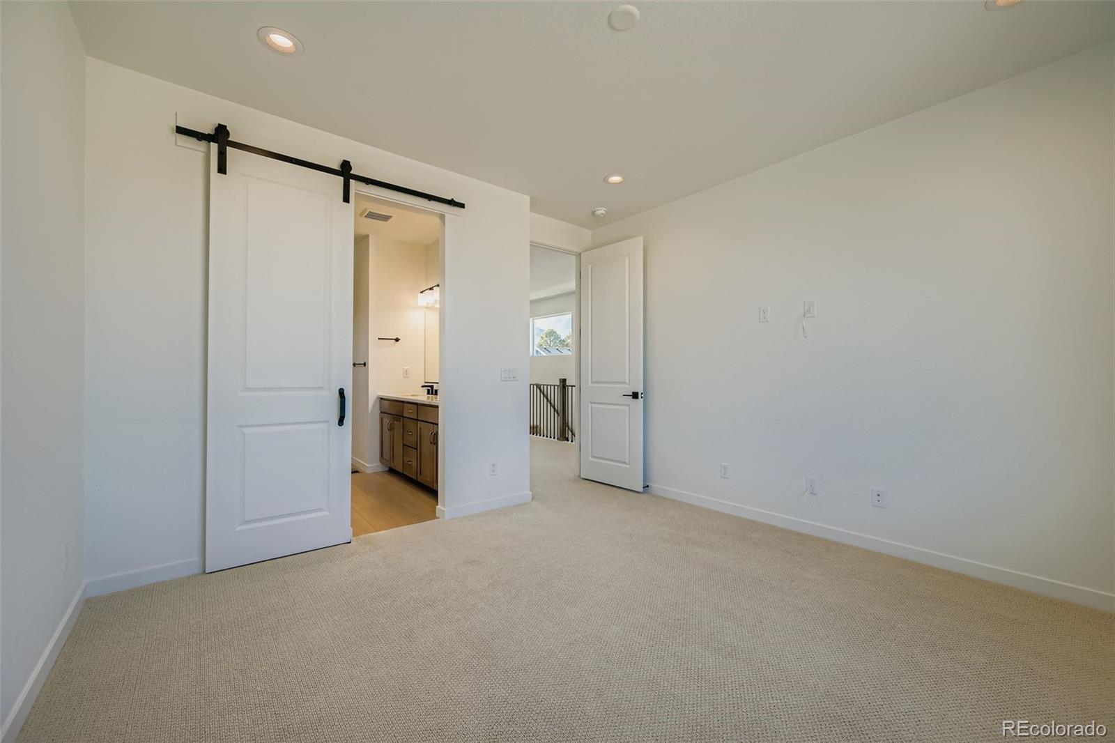 1735 Keystone Crest Lane Colorado Springs, CO 80904 - Photo 15 of 30 a view of a big room with closet and a bathroom