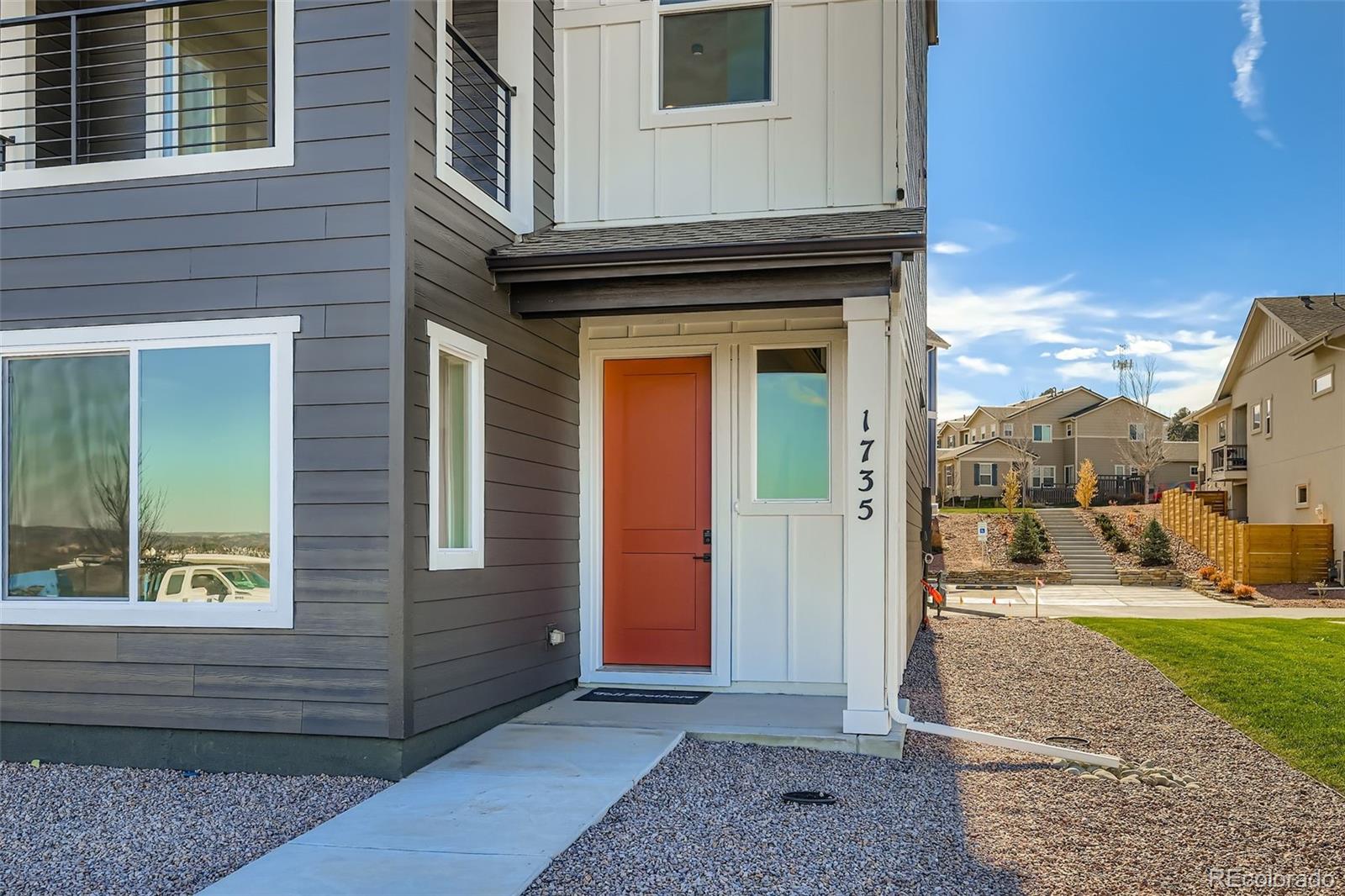 1735 Keystone Crest Lane Colorado Springs, CO 80904 - Photo 2 of 30 a view of a brick house with a outdoor space