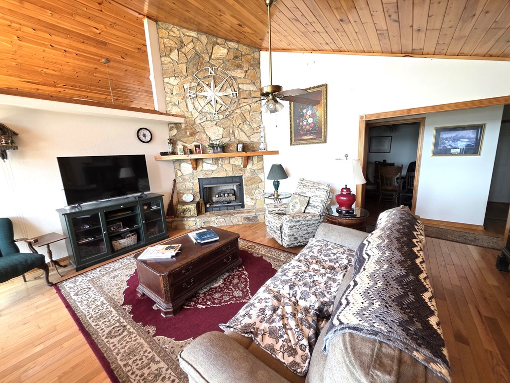 798 Timberwood Hills Road Murphy, NC 28906 - Photo 5 of 20 LIVINGROOM, VAULTED C EILING, STONE FACED GAS LOG FIREPLACE