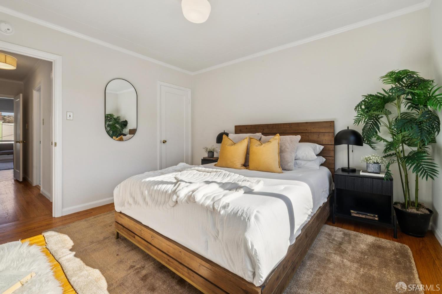 159 Stillings Avenue San Francisco, CA 94131 - Photo 11 of 21 a bedroom with bed and a potted plant