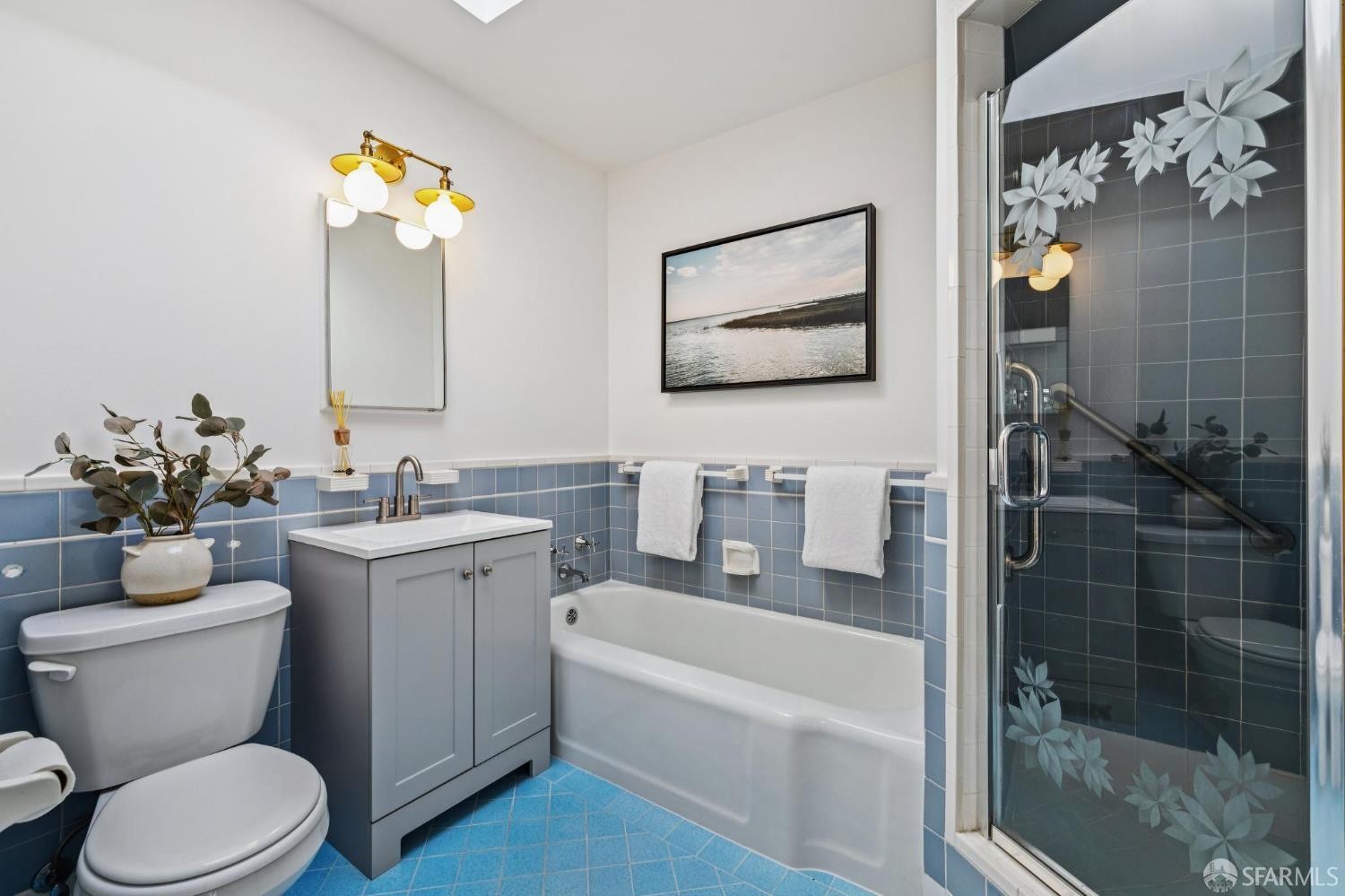 159 Stillings Avenue San Francisco, CA 94131 - Photo 12 of 21 a bathroom with a toilet a sink and mirror